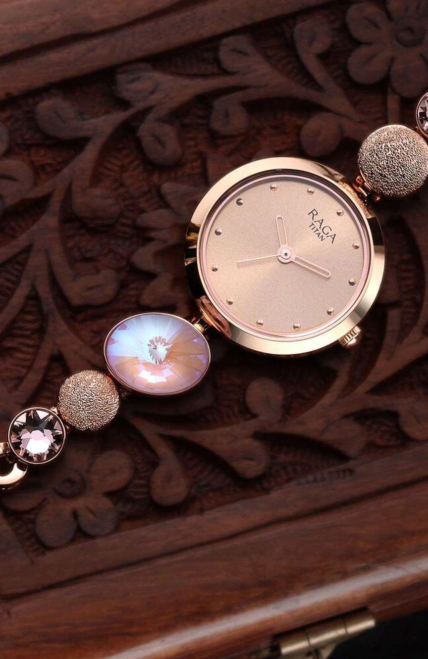 Titan Raga Women's Charm: Elegant Mother of Pearl Dial with Ornate Strap Watch